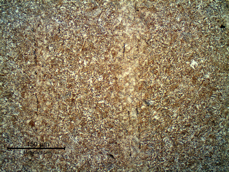 Micrography of a longitudinal section of the pin, in the center. The low carbon content of the steel in the center of the pin makes the structure bainitic even though it was quenched and tempered after carburizing.