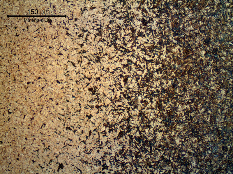 Micrographic detail a longitudinal section of the pin, at the surface, showing the case hardened. The pin carburized, quenched and tempered structure presents a gradient of carbon content and consequently a gradient of martensitic structure and hardness. Close to the surface the hardness level is 742 HV1 .