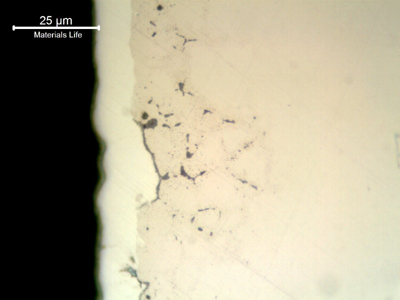The as polished micrography of a longitudinal section of the pin, showing that under the white layer of hard chromium (about 10 microns thick), there are already intergranular microcracks.