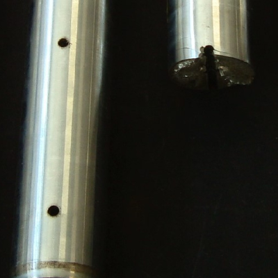 Aspect of three pins that were operating in a hydraulic system. Adjacent to the fracture of the broken pin (the one that is in the right side of the figure) it is possible to see multiple surface craks and detachment of the surface chromium layer.