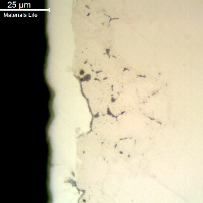 The as polished micrography of a longitudinal section of the pin, showing that under the white layer of hard chromium (about 10 microns thick), there are already intergranular microcracks.