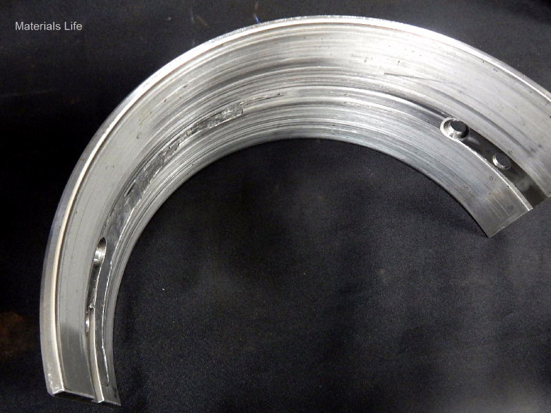 Bimetallic engine bearing, removed from service at the end of its life.