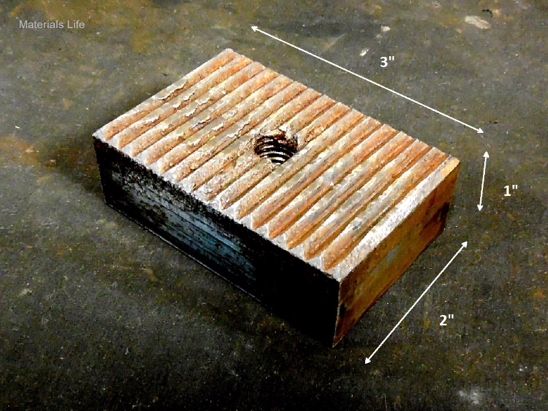 Aspect of the serrated walrus tool, interchangeable, that was removed at the end of its life. Dimensions of 1" thick, 2" width, 3" long.