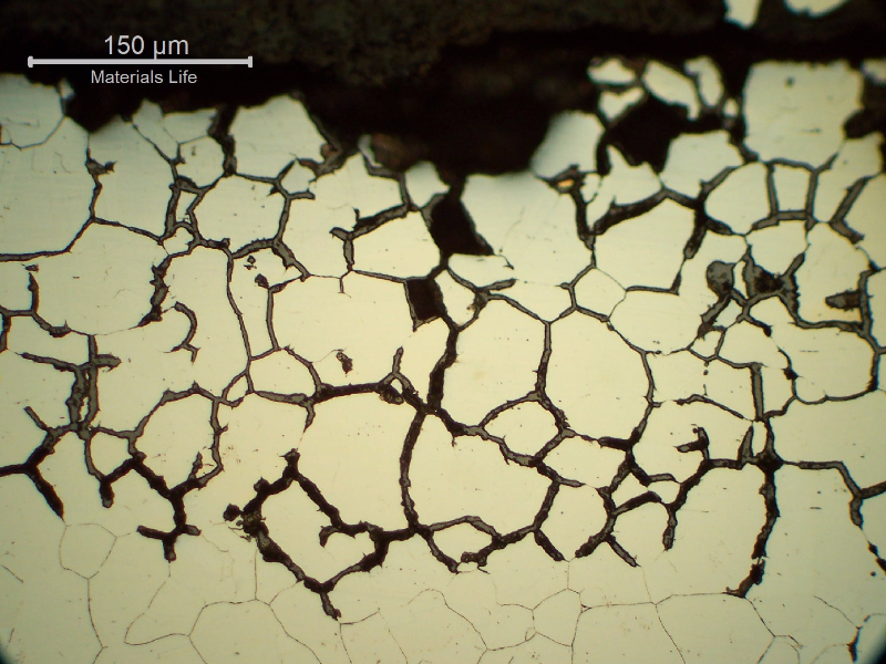 Micrographic detail of the intergranular corrosion at the internal surface of the tube in position 2. Several grains were already removed by the corrosion.