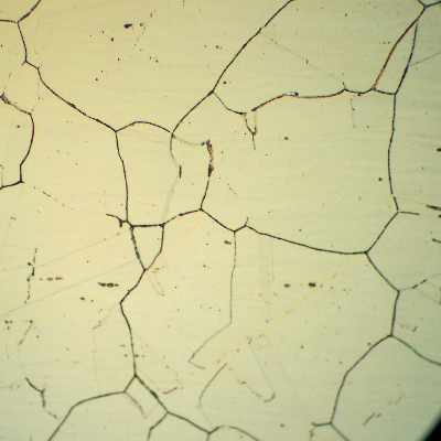 Micrography of the 1.65 mm thickness tube, in the middle of the thickness of the longitudinal section.  This part of the tube is located in the colder part of the equipment, position 1.  The material presented carbide precipitation at grain boundaries (not yet fully surrounding the grains) and at this point the tube presented no internal corrosion.