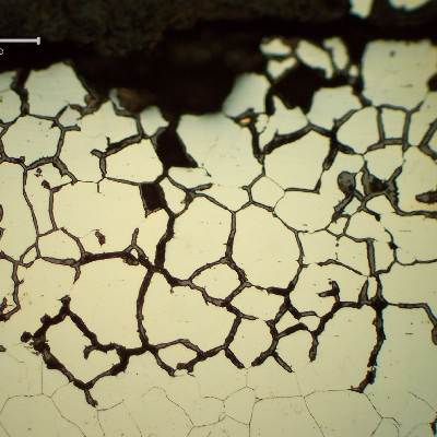 Micrographic detail of the intergranular corrosion at the internal surface of the tube in position 2. Several grains were already removed by the corrosion.