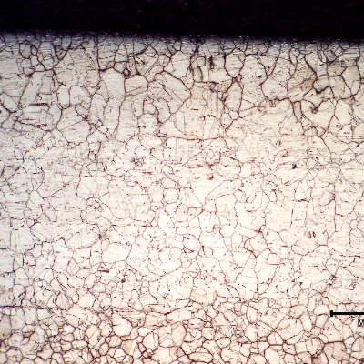Micrography of a longitudinal section of the tube in position 3, at the internal surface.  Although there is a strong precipitation, both intergranular and transgranular, the tube did not corrode at this point.