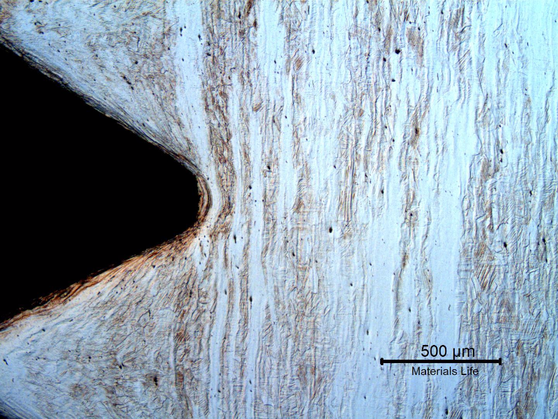 Micrography of the longitudinal section of the bolt, at the thread. The bolt was cold deformed and the thread was cold rolled.