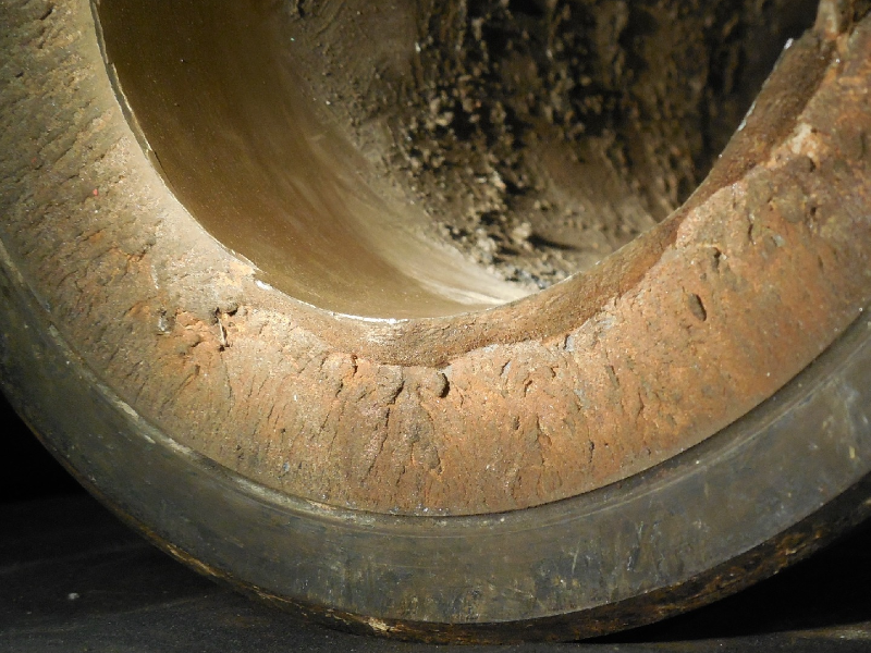 Visual aspect of the tool joint (TJ) that fractured in the pin body when it was assembled (the box appears as a sleeve in the pin OD).  The internal coating is not damaged. The fracture is flat and presents little evidences of plastic deformation, indicating that the pin broke in a brittle way.