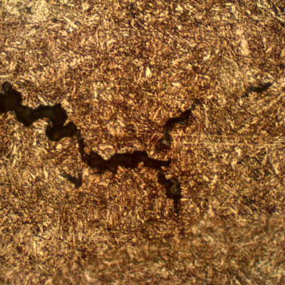 Micrographic detail of a secondary intergranular cracking at the pin longitudinal section (transverse to the fracture).