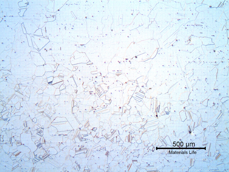 The micrography of a longitudinal section, at the bolt head close to the surface of the original bar. In this region the material increased the grain size due to the lack of particles (inclusions), to "arrest" the grain boundaries (during hot forming and solution annealing). The smaller grain size is located in the center of the bar, that concentrated the inclusions.