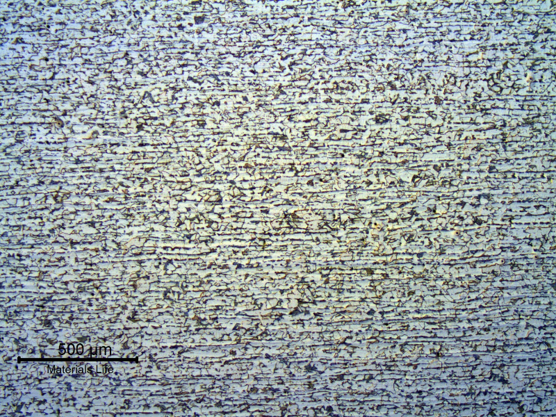 Micrography of a longitudinal section of the tube, in the center of the thickness.  
ND 3".  7.6 mm thick.