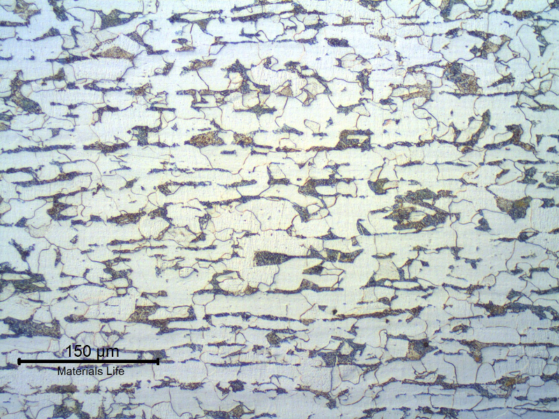 Micrography of a longitudinal section of the tube, in the center of the thickness.  
ND 3".  7.6 mm thick.