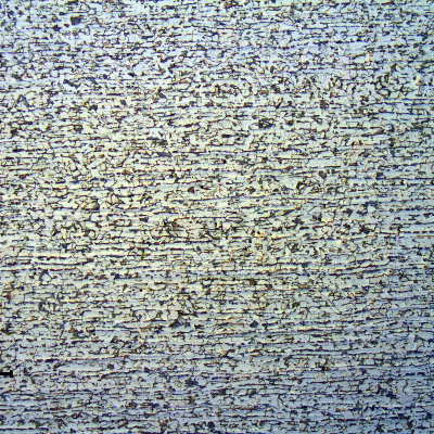 Micrography of a longitudinal section of the tube, in the center of the thickness.  
ND 3".  7.6 mm thick.