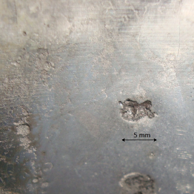 The macroscopic aspect of the surface after preparation. Grinding and polishing.