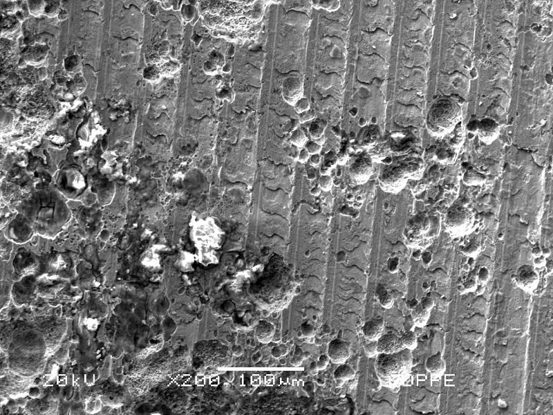 Details of the pitting corrosion at the internal surface. There are cracks inside some pits.