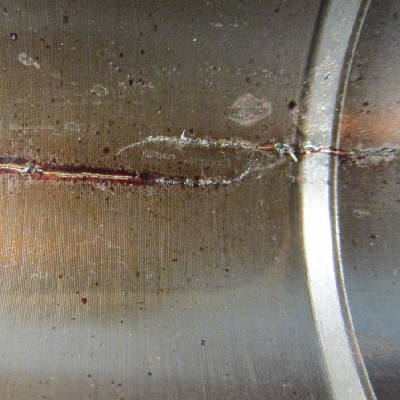 Aspect of the internal side of the housing presenting multiple cracks in longitudinal direction.