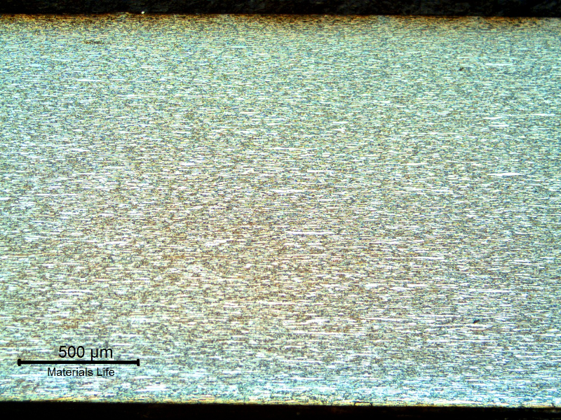 Micrography of the tubing longitudinal section, showing a refined austenitic ferritic structure.