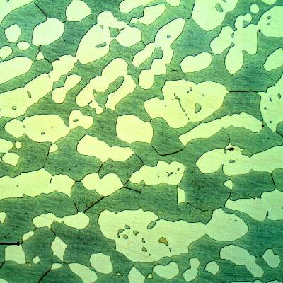 Micrographic detail of the fitting longitudinal section showing a coarse austenitic ferritic structure.