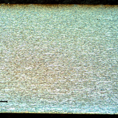 Micrography of the tubing longitudinal section, showing a refined austenitic ferritic structure.