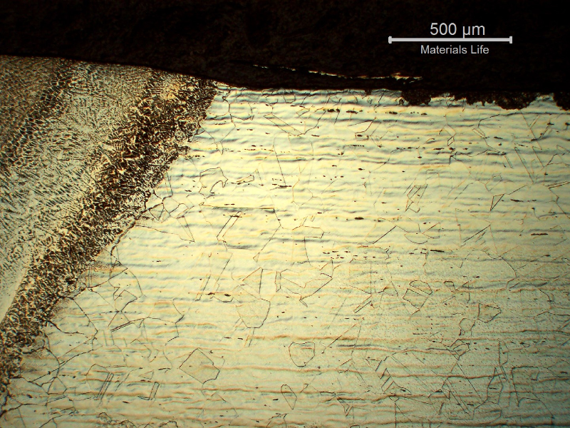 Micrography of the longitudinal section of the line at the fusion line of the fitting, close to OD. It is possible to see that the base metal is austenitic and the weld metal is austeno-ferritic. In the center of the thickness the average hardness of the fitting is 250HV1 and the average hardness of the weld metal is 180HV1.