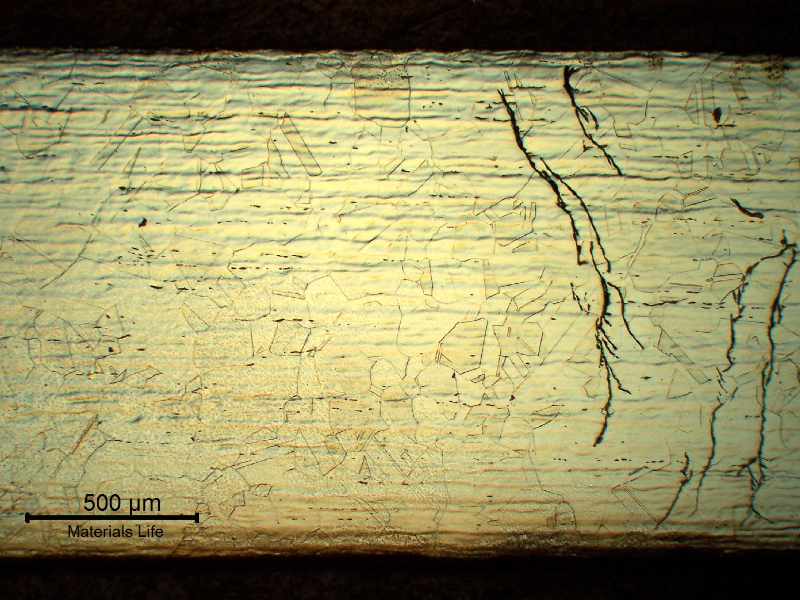 Micrography of the longitudinal section of the hydraulic line sample at the cracking position, localized in the fitting and starting from the outer diameter (OD).