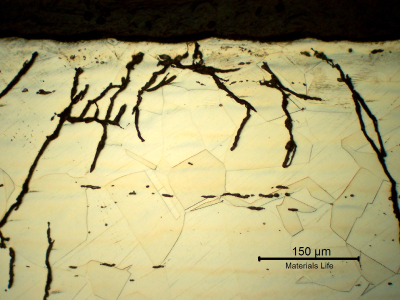 Micrographic detail of the branched cracks at the fitting, close to OD.