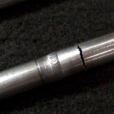 Aspect of the hydraulic line samples removed from service to be analyzed.  Tubing and welded joint (bottom sample) between the 316 tubing (left side of the sample) and the nitronic fitting (right side of the sample).   The cracking is located 10 mm far from the weld, autogenous orbital GTAW.