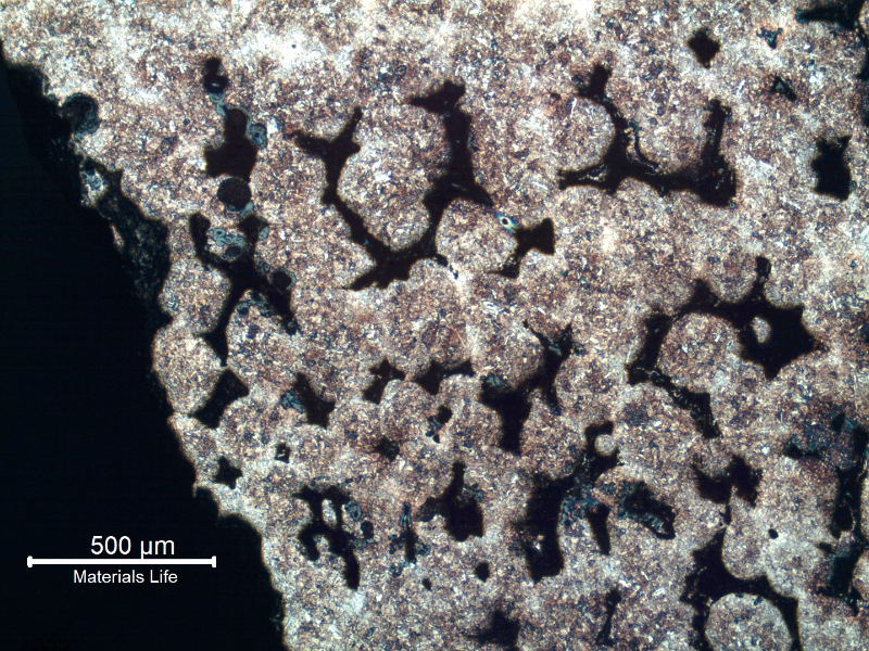 Micrography of a transverse section of the lifting part, showing interdendritic voids close to the surface at the inner diameter of the padeye. The microstructure is tempered martensite.