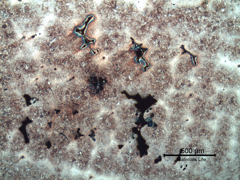 Micrography of a region where there is a large amount of casting defects. Shrinkage voids in interdendritic spaces, some interconnected and cracked.