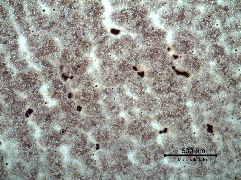 Micrography of the lifting padeye showing a dendritic path of a quenched and tempered martensitic microstructure.  The segregated regions (white interdendritic regions) are more clearly identified in low magnification. Voids are located in these segregated regions.