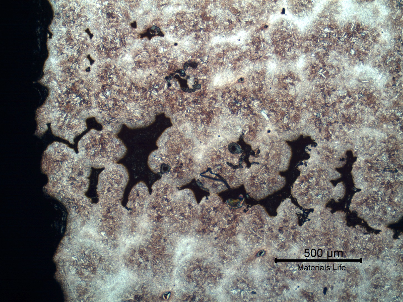 Micrography of a region where there is a large amount of casting defects. Shrinkage voids in interdendritic spaces, some interconnected and cracked.