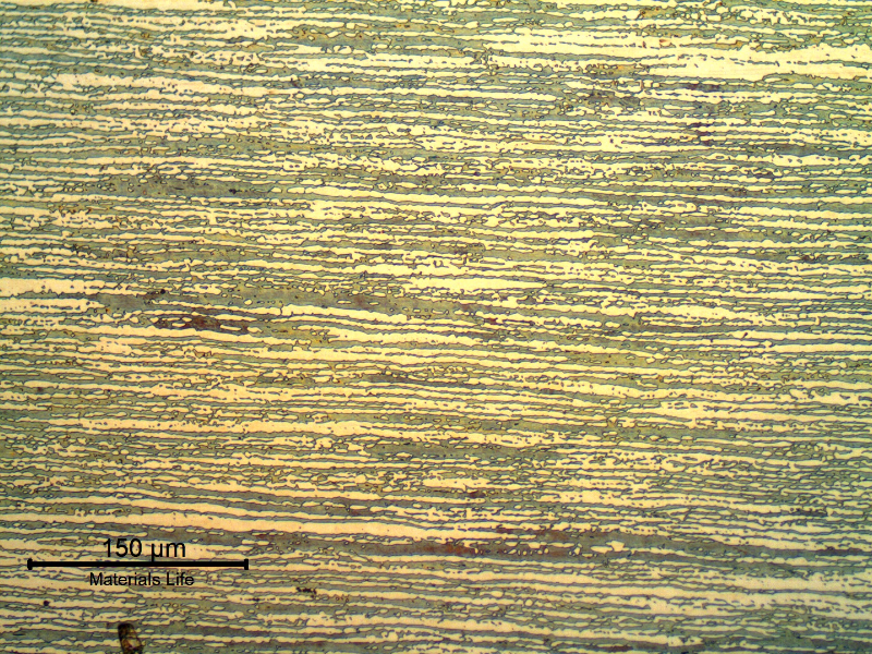 Micrography of the superduplex stainless steel tubing (base metal), in the longitudinal direction.  
Refined ferritic-austenitic structure.