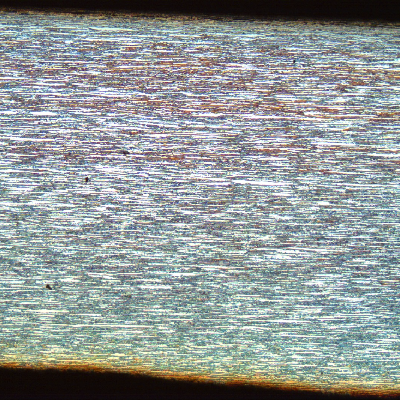Low magnification micrography of the superduplex stainless steel tubing (base metal), in the longitudinal direction.  Refined ferritic-austenitic structure. The average hardness in the section is 264HV5.