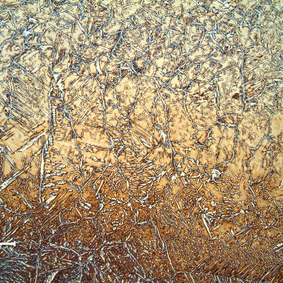 Micrography at the center of the weld metal, showing the interface between the two passes. The average hardness of the weld metal is 260 HV5.