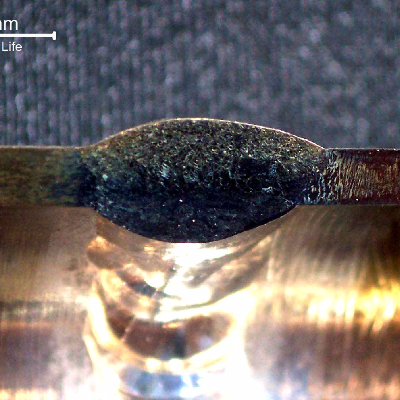 Macrography of the welded joint between a forging connector (right side) and a seamless tubing (left side).  It was welded in two passes by GTAW process.