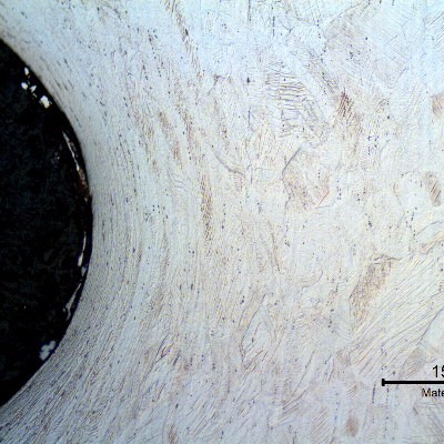 Micrography of the longitudinal section of the bolt, at the thread. The bolt was cold deformed and the thread was cold rolled.