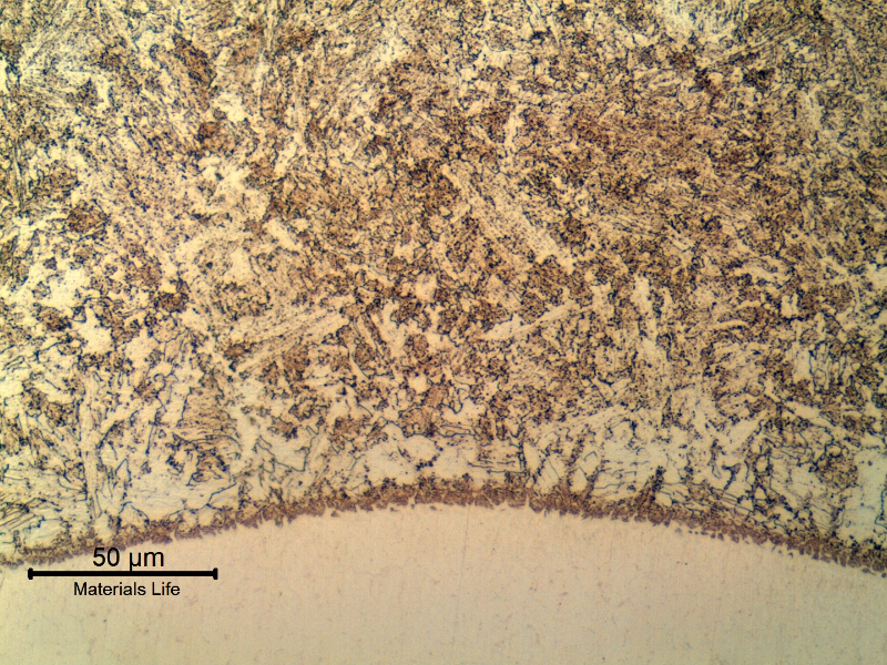Micrographic detail of the bainitic heat affected zone (HAZ) of 4130 forging at the Inconel overlay.