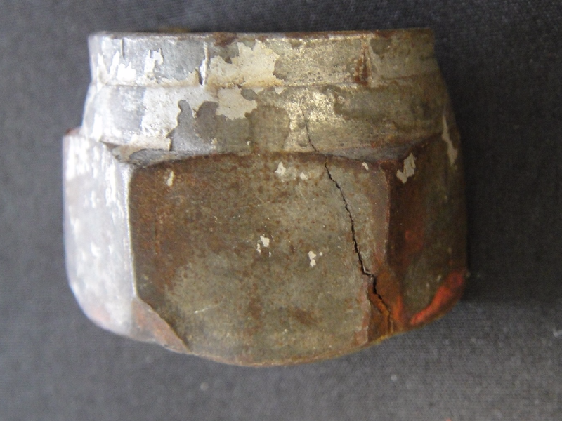 Aspect of the external side of the connector, with a longitudinally crack of a brittle aspect. 
It is a 5/8" connector (15.8 mm).