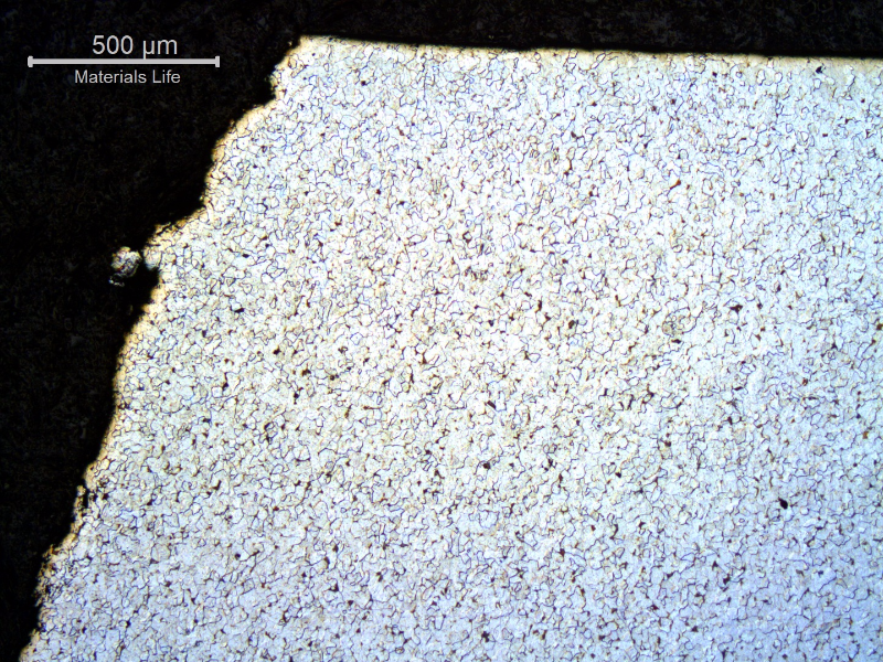 Micrography of a transverse section, perpendicular to the fracture surface, showing lack of plastic deformation during rupture.