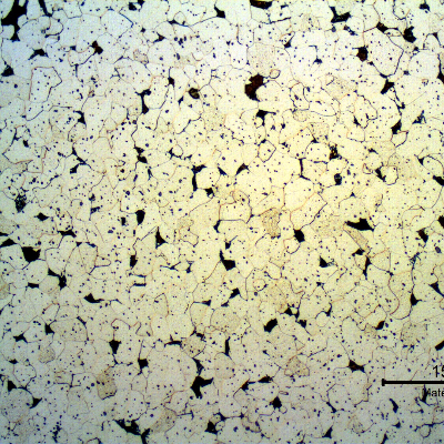 Micrography of the transerse section of the fitiing, in a free-cutting steel.  The microstructure is predominantly ferritic and the inclusions appear as dots.