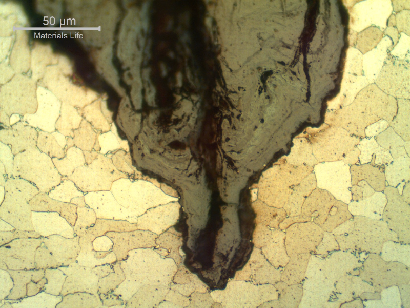 Micrographic detail of the thermal fatigue cracking, assisted by corrosion, at the OD, in a longitudinal section. The microstructure is ferrite with coalescing carbides.