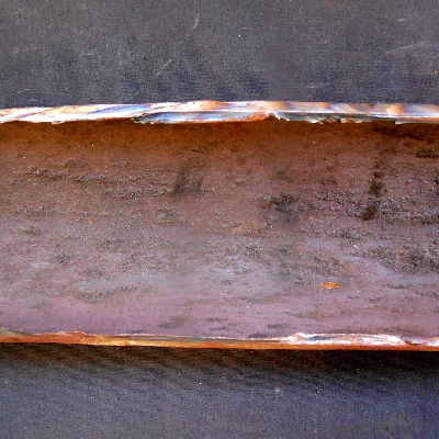Aspect of the internal surface of the tube after longitudinal cut. 
This position is out of the damage area and only a small amount of deposits is evident.
