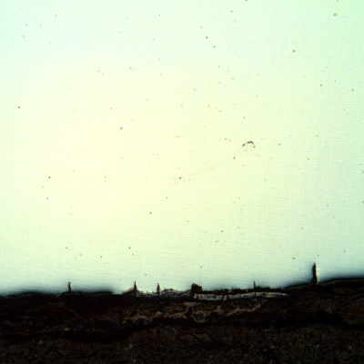 The micrography of the longitudinal section of the tube, close to ID, shows the paralel cracks, filled with oxides, perpendicular to the surface.