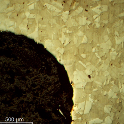 Low magnification micrography of the bolt in a longitudinal section, at the bolt head, showing no evidences of forming operations, indicating it was machined from a heat treated bar. 
Austenitic microstructure, granular, equiaxial, precipitation hardened (shadow in the grains).