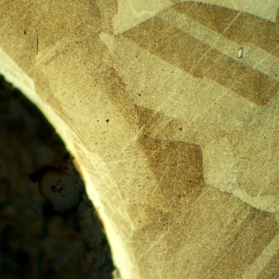 Micrographic detail of the bolt in a longitudinal section, at the bolt thread, showing no evidences of forming operations, indicating it was machined from a heat treated bar. 
Austenitic microstructure, granular, equiaxial, precipitation hardened (shadow in the grains).