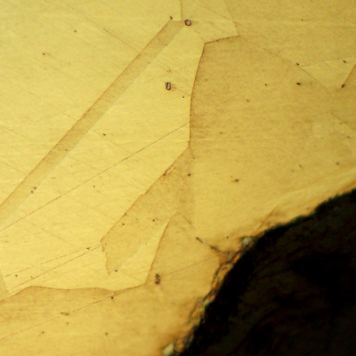 Micrography of the bolt in a longitudinal section, at the bolt thread, showing no evidences of forming operations, indicating that it was machined from a heat treated bar. Austenitic microstructure, granular, equiaxial.