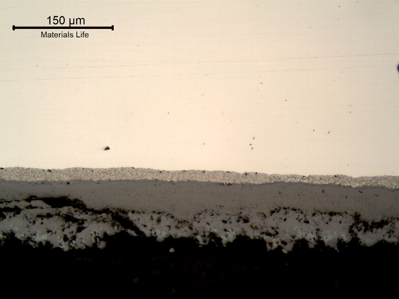 Micrography of the longitudinal section of the tube, close to the internal surface, presenting a thick deposit.