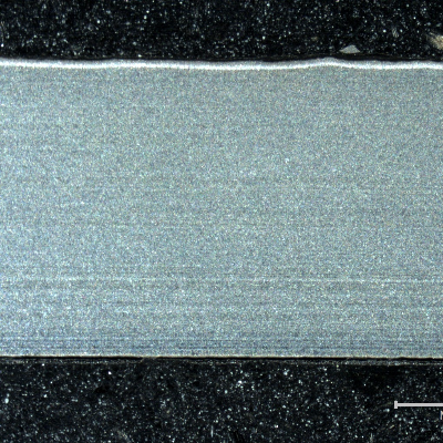 The macrography of a longitudinal section shows that the tube did not present local thinning in any region, but the internal and external scales are evidenced. The external surface (OD) is to the top of the figure and the internal surface (ID) is to the bottom of the figure.
