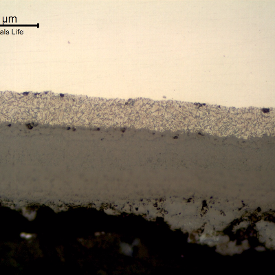 Micrographic detail of the longitudinal section of the tube, close to the internal surface, presenting a thick deposit.